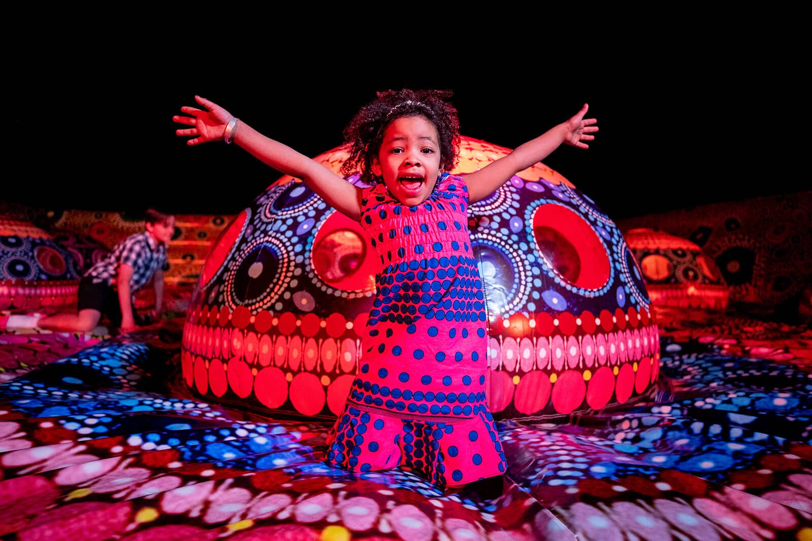 A girl enjoying the display at Parrtjima